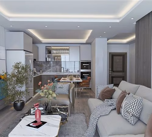 Modern and luxurious open-plan living room with a cozy sofa, stylish decor, and a contemporary kitchen in the background. Features a sleek marble coffee table, warm lighting, and elegant wall accents. Perfect for comfortable and upscale living.